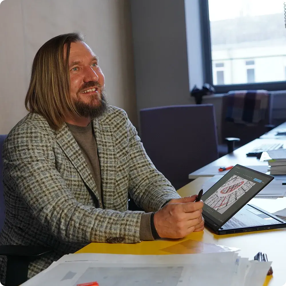 A photo of Dmytro Vasyliev with ASUS ProArt PX13 Laptop.
