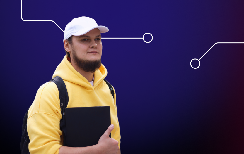 Чоловік з ноутбуком дивиться вперед