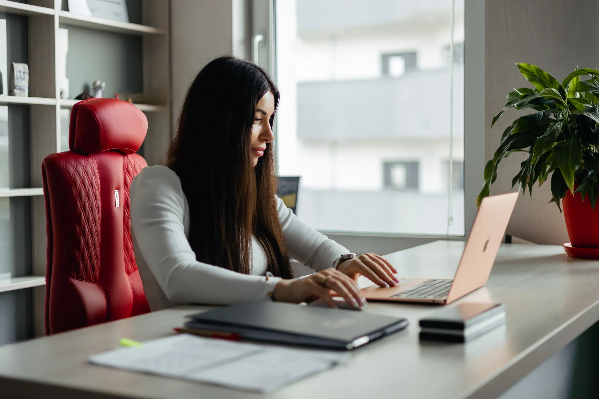 A photo of Tetiana Nikolenko with a laptop.